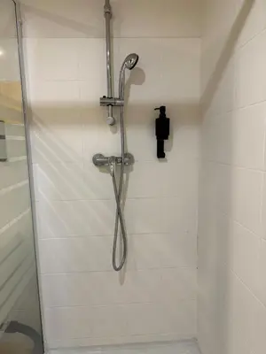 a shower with a shower head in a bathroom at Le Clos D'AIX Studio 108 in Aix-en-Provence
