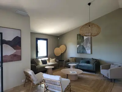 a living room with couches and a table at La Bastide des Amis in Caromb