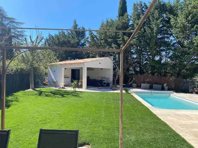 a backyard with a pool and a house at 3 bedroom villa with pool in Aix-en-Provence
