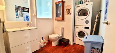 a bathroom with a toilet and a washing machine at Spacious apartment 4 people parking, bright in Aix-en-Provence