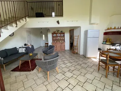 a living room with a couch and chairs and a table at Maison d'hôte en Provence avec petit déjeuner in Mollégès