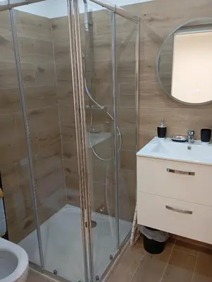 a shower in a bathroom with a sink and a toilet at studio in Morières-lès-Avignon