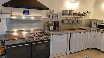 a kitchen with a stove and a sink at Roussillon House in Roussillon