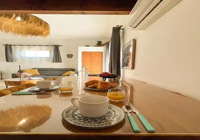 a living room with a couch and a coffee table at Nature&détente au pied du Mont Ventoux parking privé gratuit in Carpentras