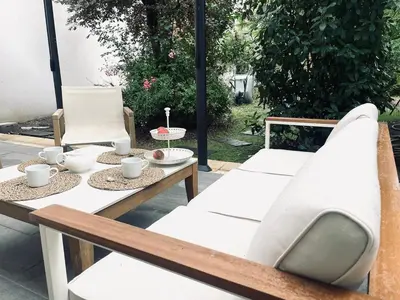 a table and chairs sitting on a patio at Casa Regina - Spacieux appartement près de la Sorgue in LʼIsle-sur-la-Sorgue