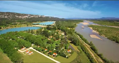 an aerial view of a house next to a river at Mobilhome 6 personnes in Cheval-Blanc