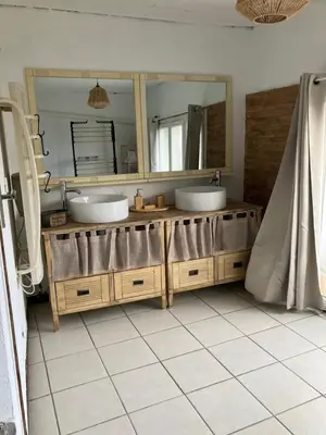 a bathroom with two sinks and a large mirror at Maison de village à Pertuis in Pertuis