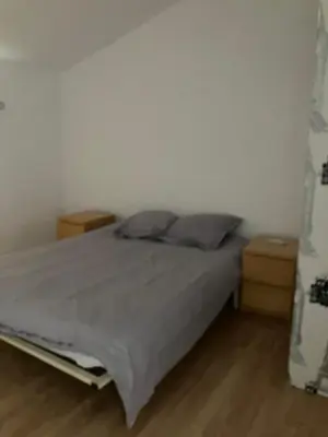 a bedroom with a bed and two night stands at Maison de village à Pertuis in Pertuis