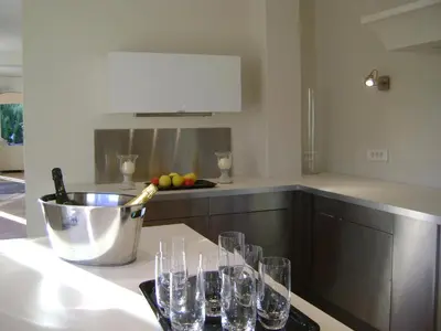 a kitchen with wine glasses on a counter at Bastide des Lauves in Aix-en-Provence