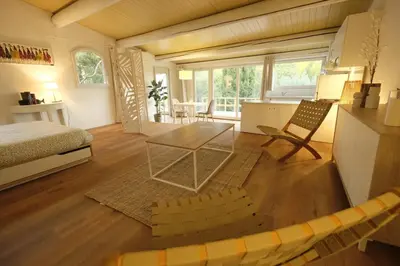 a bedroom with a bed and a table in a room at L'Observateur in Aix-en-Provence