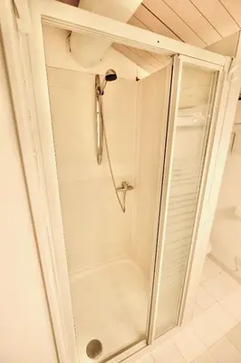 a shower with a glass door in a bathroom at L'Observateur in Aix-en-Provence