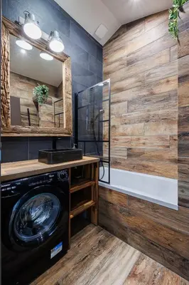 a bathroom with a washing machine and a mirror at Duplex Factory II Hyper Centre in Salon-de-Provence