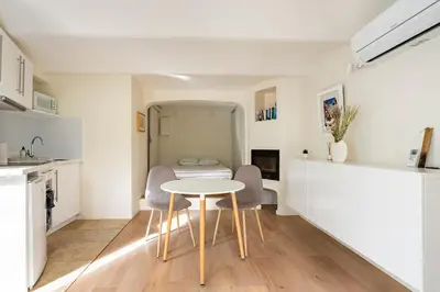 a kitchen and dining room with a table and chairs at Le Dandy in Aix-en-Provence