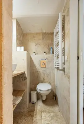 a small bathroom with a toilet and a sink at Le Dandy in Aix-en-Provence
