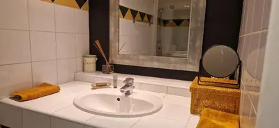 a white bathroom with a sink and a mirror at Loft in hôtel particulier, city-center, air conditioned in Aix-en-Provence
