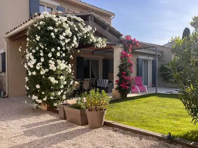 a house with flowering plants in a yard at Mas Rémy-Villa in private residence in Saint-Rémy-de-Provence