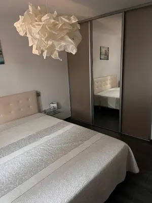 a bedroom with a bed and a large mirror at Mas Rémy-Villa in private residence in Saint-Rémy-de-Provence