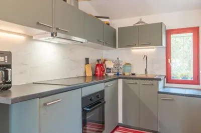 a kitchen with stainless steel appliances and a window at Finsonius Studios in Aix-en-Provence