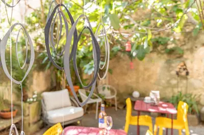 a patio with a table and chairs and a table and chairsktop at Finsonius Studios in Aix-en-Provence