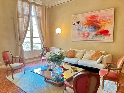 a living room with a couch and a table at L Appart Aixois in Aix-en-Provence