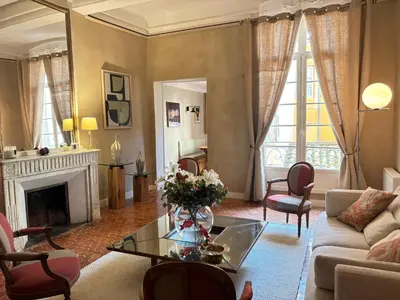 a living room with a couch and a fireplace at L Appart Aixois in Aix-en-Provence