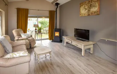 a living room with a couch and a tv at Lovely Home In Carpentras With Wifi in Carpentras