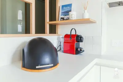 a black computer mouse sitting on top of a counter at Le Cézanne in Aix-en-Provence