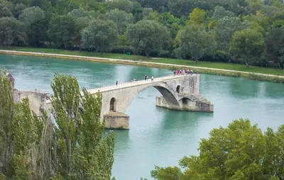 a group of people crossing a bridge over a river at 2 Bedroom Lovely Home In Vedène in Vedène