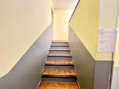 a stairway with wooden steps in a building at Lou Miradou 2 - Vieux village médiéval, Cosy, Clim, 2 personnes in Miramas