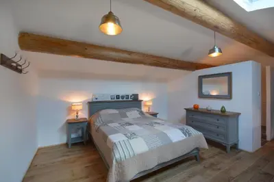 a bedroom with a bed and two night stands at Le domaine de Villemus chambre d'hote in Jouques