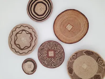 a group of four brown plates on a white background at Le Mazet des Jasmins in Gordes