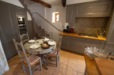 a kitchen with a table with a turkey on it at Maison Valabregue in Robion en Luberon