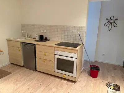 a kitchen with a sink and a stove top oven at Maisonnette in Aix-en-Provence