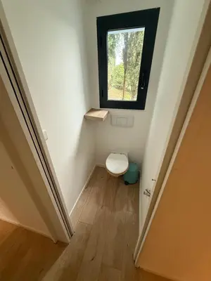 a small bathroom with a toilet and a window at Maisonnette in Aix-en-Provence