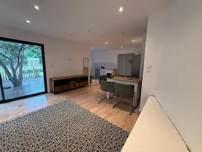 a kitchen with a table and chairs in a room at Maisonnette in Aix-en-Provence