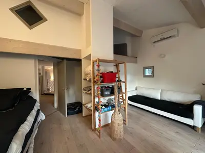 a room with a bed and a couch in a room at Maison aix en Provence piscine in Aix-en-Provence