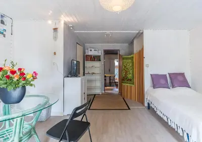 a bedroom with a bed and a glass table at Espace Ki-Zen in Pélissanne