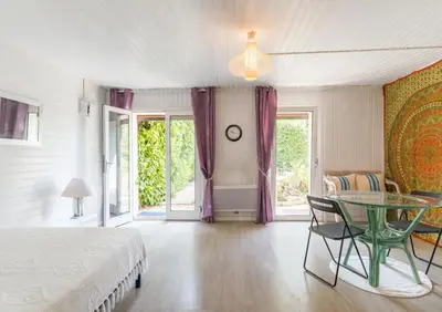 a bedroom with a bed and a glass table at Espace Ki-Zen in Pélissanne