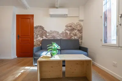 a small kitchen with a table and a sink at Studio Climatisé rdc plein centre in Aix-en-Provence