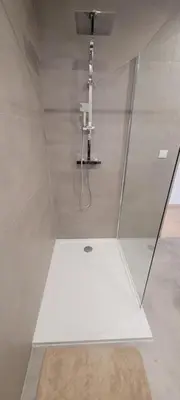 a shower with a glass door in a bathroom at Charming villa with a pool in Cadenet