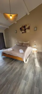 a bedroom with a large bed in a room at Charming villa with a pool in Cadenet