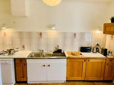 a kitchen with a sink and a counter top at Provencal farmhouse in Luberon's heart with pool in La Bastide-des-Jourdans