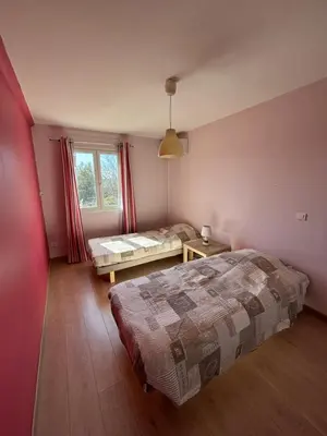 a bedroom with a bed and a window at Mas de charme provencal in Cavaillon