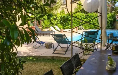 a patio with a table and chairs and a pool at Awesome Apartment In Carpentras in Carpentras