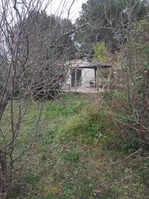 a house sitting on top of a grassy hill at Studio à la campagne in Éguilles