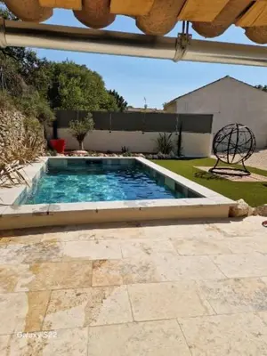 a swimming pool in the backyard of a house at La l isloise in LʼIsle-sur-la-Sorgue