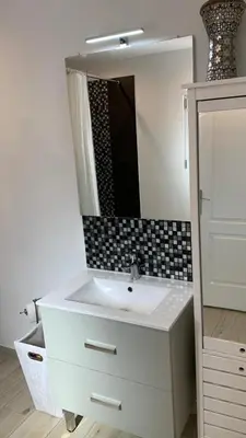 a bathroom with a white sink and a mirror at Villa climatisée dans Domaine privé Aix en Provence in Aix-en-Provence