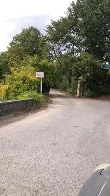 a road with a sign on the side of it at Villa climatisée dans Domaine privé Aix en Provence in Aix-en-Provence