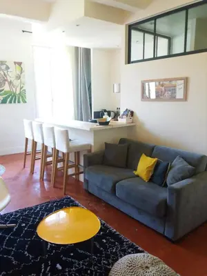 a living room with a couch and a table at Gorgeous! heart of Aix en Provence appartement climatisé in Aix-en-Provence