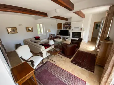 a living room with a couch and a table at Le Mas de Quatremonts - Your refuge in Provence in Bonnieux